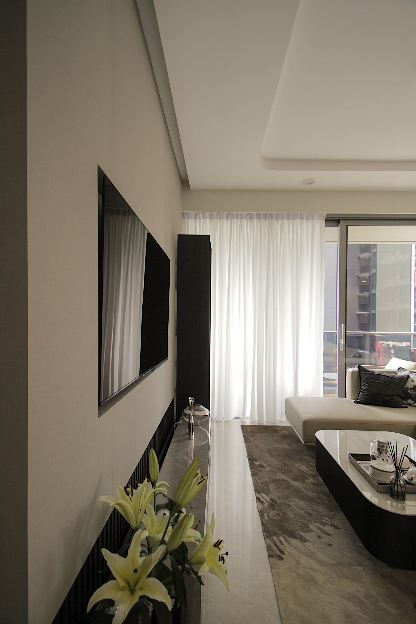 Recessed mounted TV flushed with an elegant feature wall to showcase a seamless design.