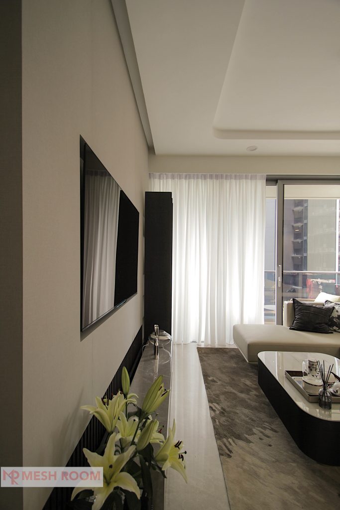 Recessed mounted TV flushed with an elegant feature wall to showcase a seamless design.