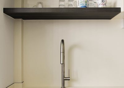 •Retro theme design •Open concept Kitchen •Vintage terrazzo flooring •Long Kitchen cabinet •Impact and stain resistant Kitchen worktop and backsplash •Back splash •Removable sink cover •Track lights creating a warm ambience •Cosy Living space