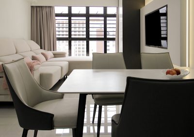 Customized carpentry works to maximize storage space yet allowing lots of living space throughout the entire home with a hidden workstation tucked into the corner of the living room. With a mix of neutral tone laminates, soft furnishing and well placed lightings iluminates the entire area and brings about a cosy tone to the enviroment.